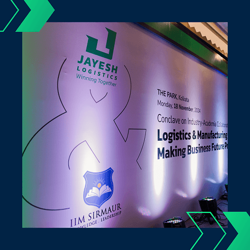 The official event backdrop featuring logos of Jayesh Logistics, IIM Sirmaur, and the Conclave theme on November 18, 2024, in Kolkata.
