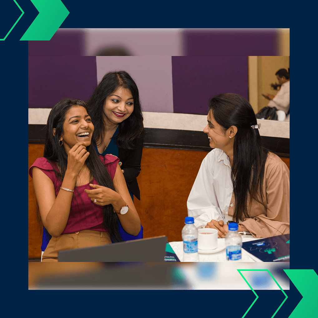 Janhavi Mehta laughing with other attendees during a networking break at the Jayesh Logistics Conclave on November 18, 2024.